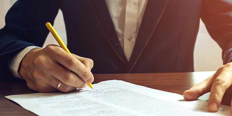 Male Hand Holding a Pen