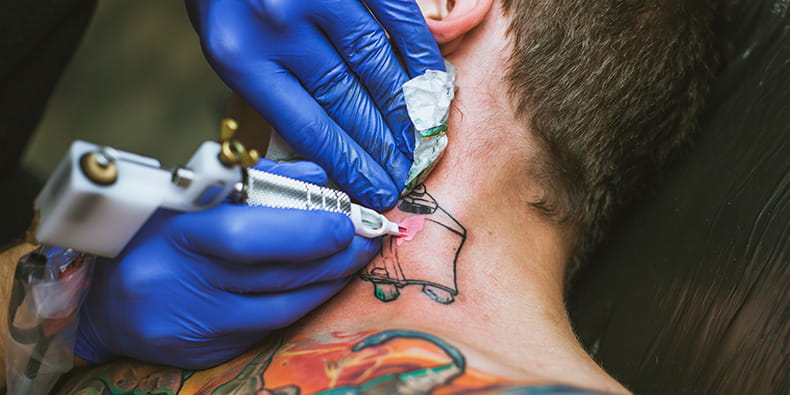 Tattoo Artist Making Neck Tattoo