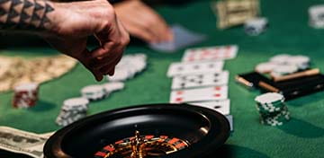 Tattooed Man Playing Roulette