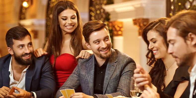 Group of People Playing Blackjack in a Casino