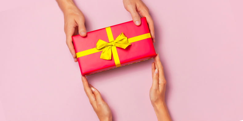 Woman Handing Over a Giftbox