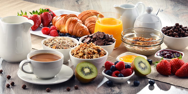 Diverse Foods and Beverages on a Table