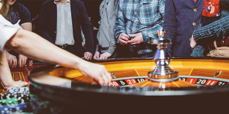 Group of People Plays Casino Roulette