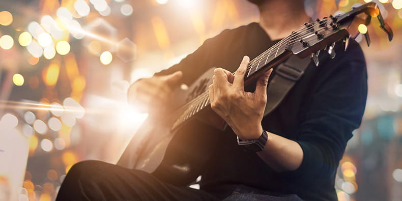 Musician Playing Acoustic Guitar